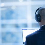 a man working while using headphones