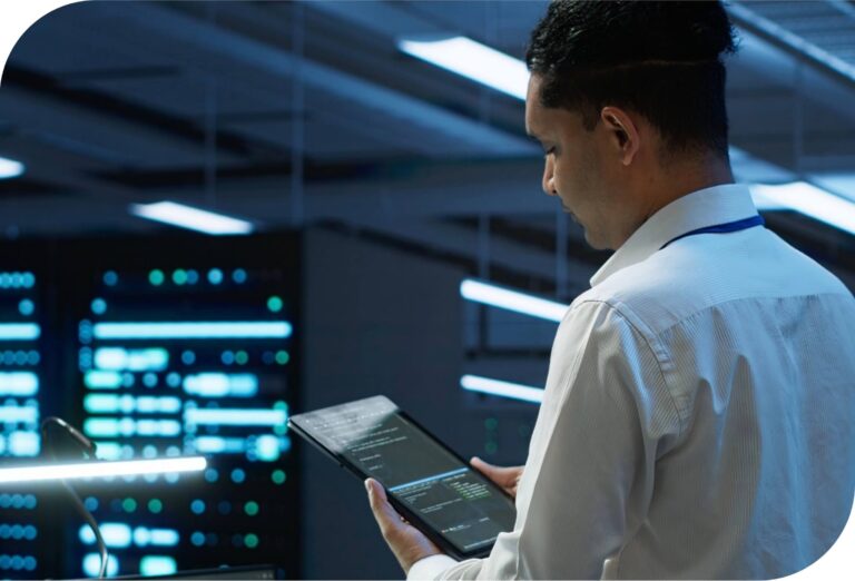 Server room security with man on tablet looking at code