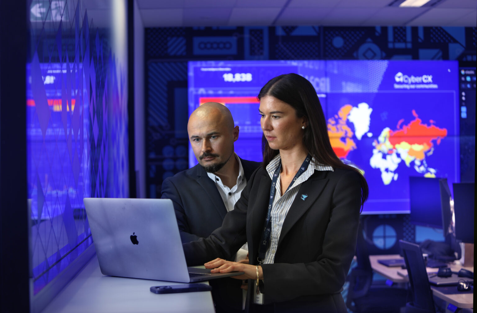 CyberCX security consultants on a laptop